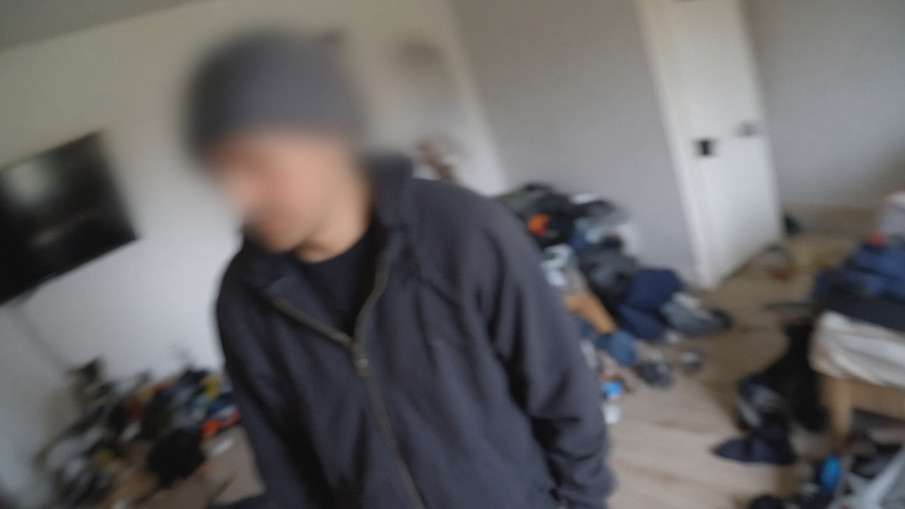 Shaky, tilted frame where faces are hard to see